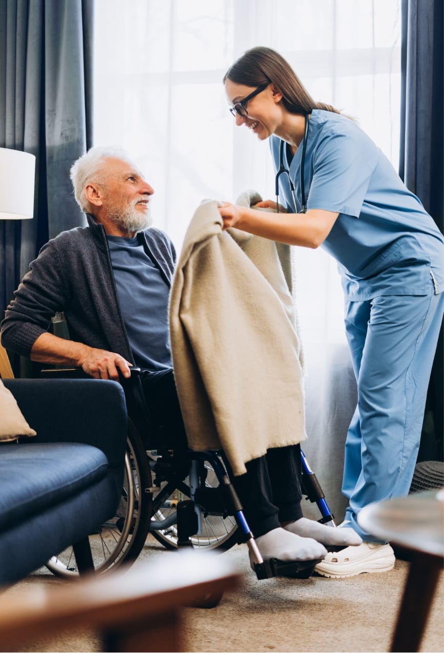 Nurse caring for senior man in wheelchair